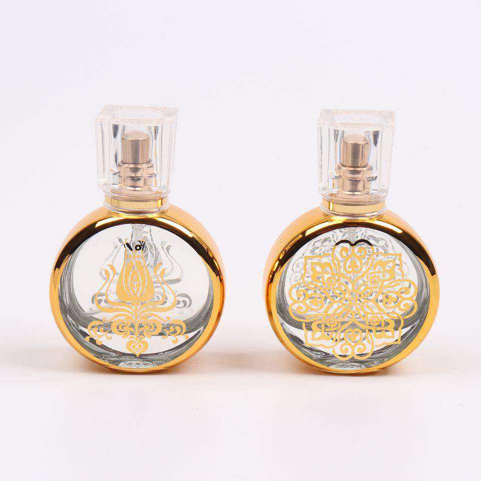 UV engraving empty luxury golden glass 30ML perfume bottle with clear plastic lid